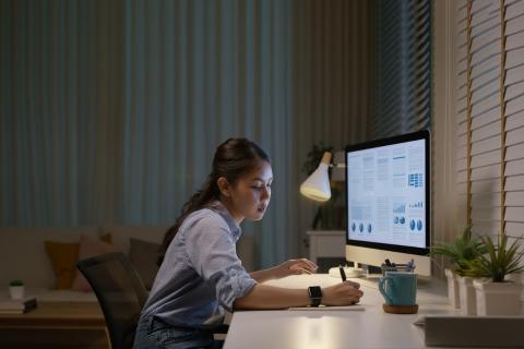 Girl sat at desk studying