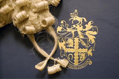 Barrister's wig placed next to RCVS crest